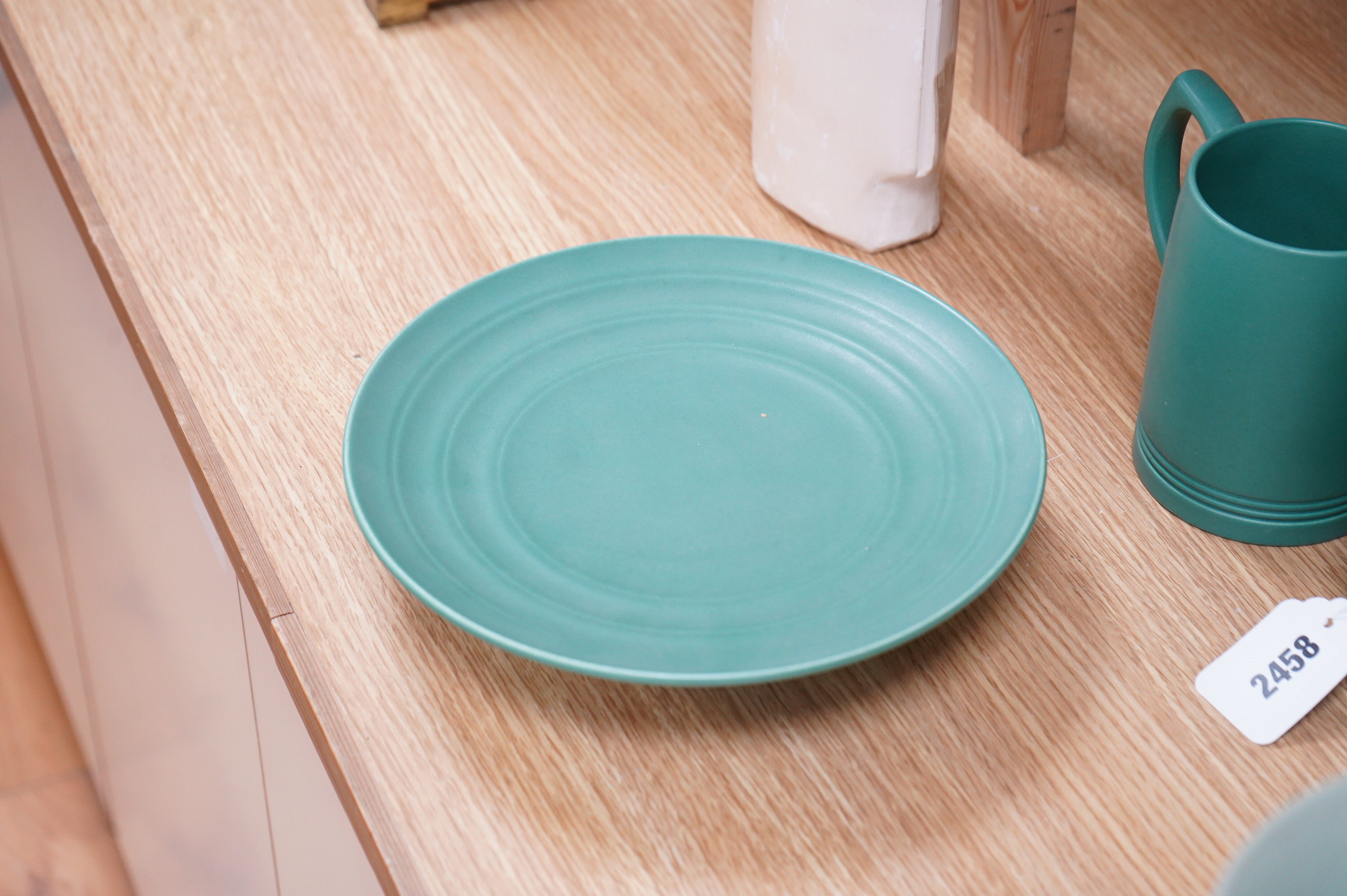 Keith Murray for Wedgwood, a green glazed ribbed tazza or footed dish, 23cm in diameter